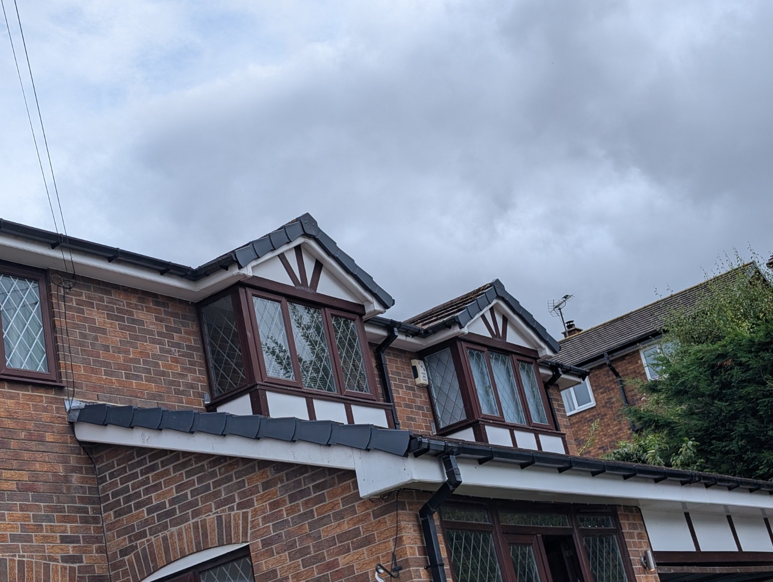 Brick property showing detailed masonry and bay windows